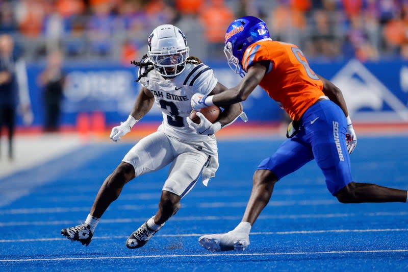 Utah State running back Rahsul Faison (3) runs with the ball against Boise State in the second half of an NCAA college football game, Saturday, Oct. 5, 2024, in Boise, Idaho. Boise State won 62-30. (AP Photo/Steve Conner) | Steve Conner