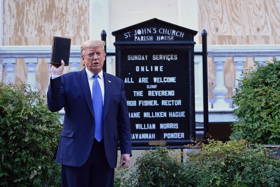 Donald Trump poses for a photo-op after saying he might deploy the military to stop national protests over police brutality and anti-Black racism. (Photo: BRENDAN SMIALOWSKI via Getty Images)