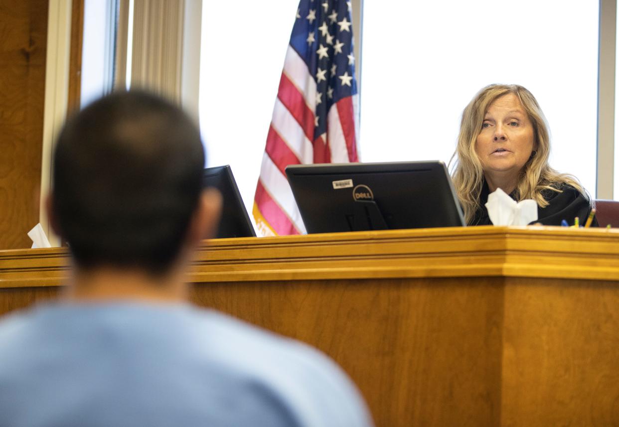Judge Audrey Broyles speaks to a defendant during an end of jurisdiction hearing at the Marion County Courthouse in Salem.