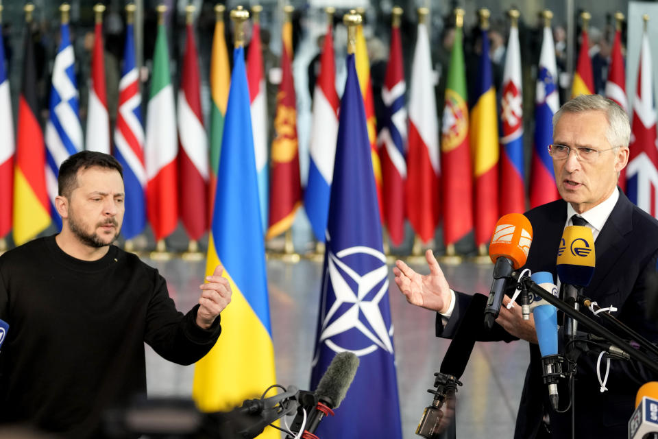 Ukraine's President Volodymyr Zelenskyy, left, and NATO Secretary General Jens Stoltenberg address a media conference prior to a meeting of NATO defense ministers at NATO headquarters in Brussels, Wednesday, Oct. 11, 2023. (AP Photo/Virginia Mayo)