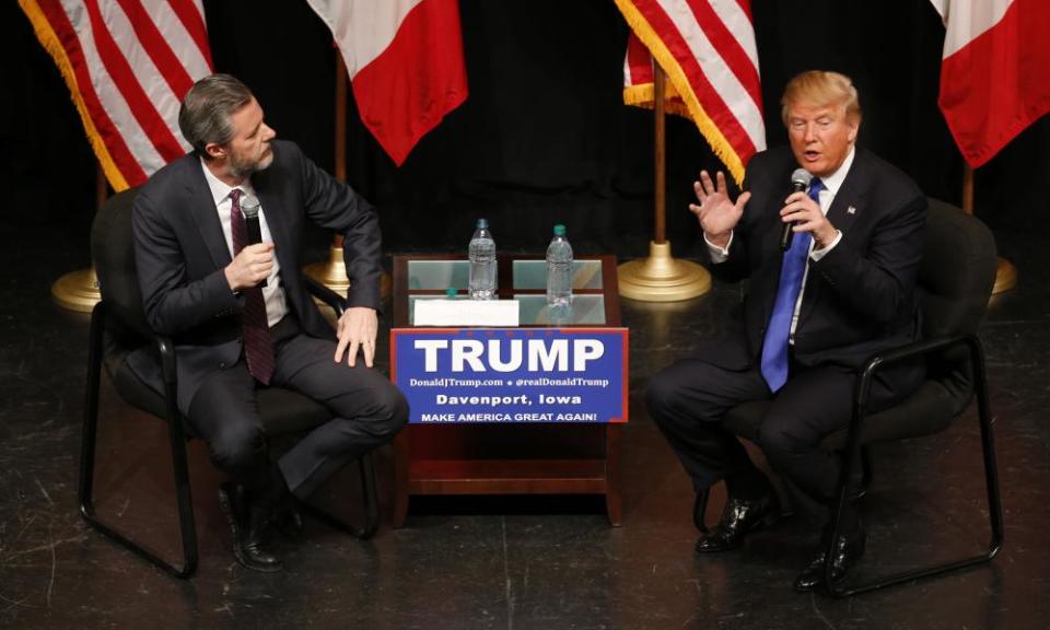 Donald Trump talks with Jerry Falwell Jr in Davenport, Iowa, in 2016.