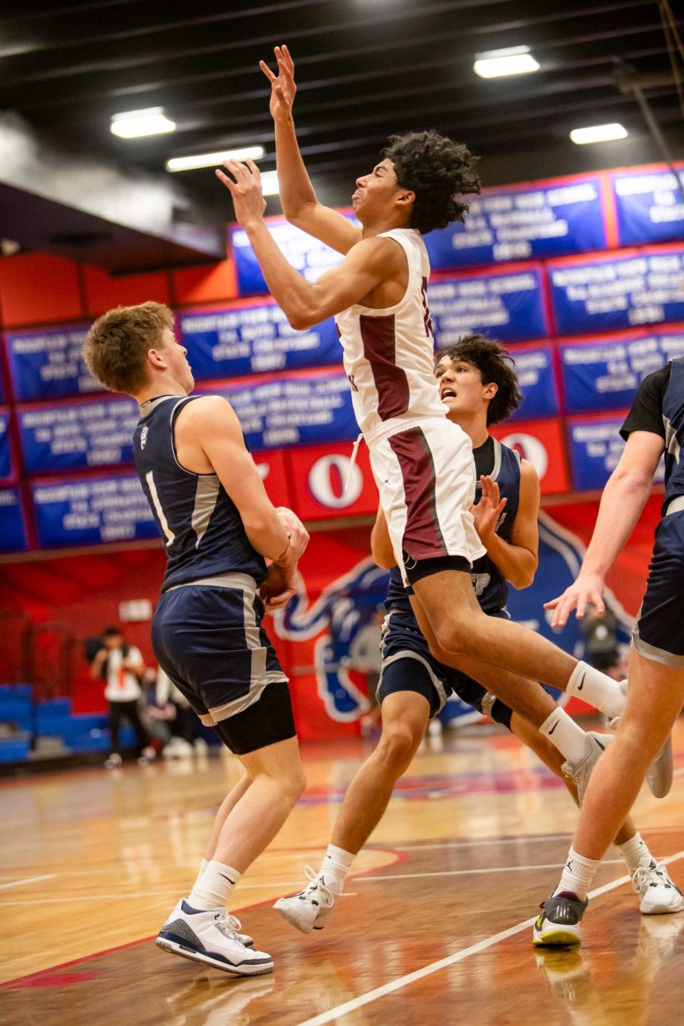 Desert Mountain Wolves' Kaden House (10) jumps to shoot the ball against the Gonzaga Prep Bullpups at Mountain View High School in Mesa on Dec. 27, 2023.