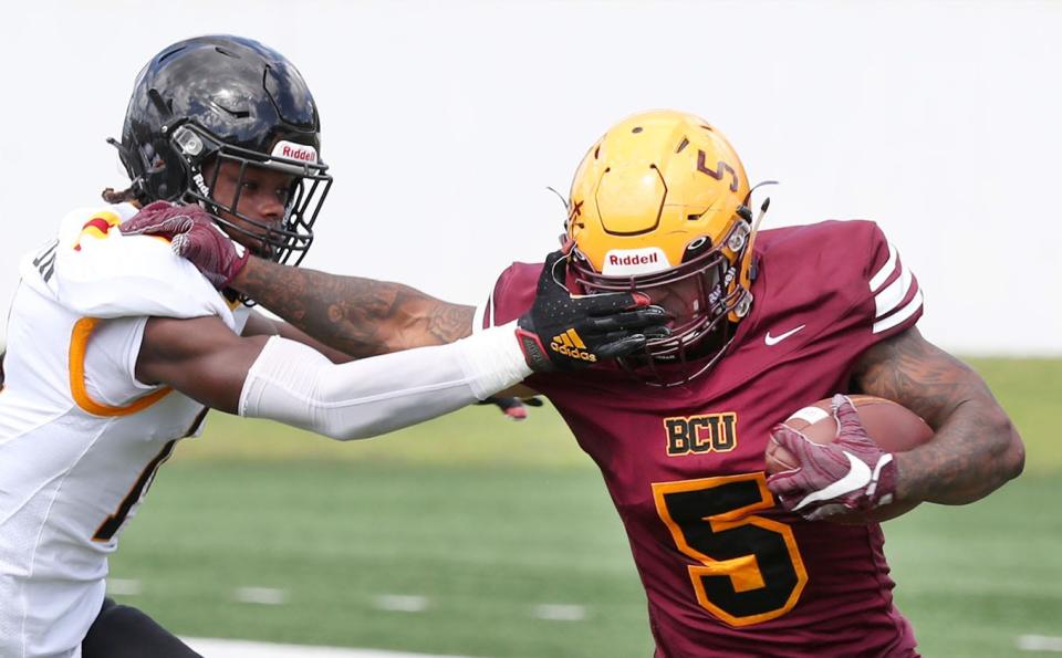 Bethune-Cookman's Que'shaun Byrd (5) fights off a Grambling State tackler Saturday Sept. 24, 2022 at Daytona Stadium.