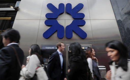 People walk past a branch of the Royal Bank of Scotland (RBS) in central London, 2011. State-rescued Royal Bank of Scotland was battling to repair an already battered reputation as it struggled to fix a week-old computer glitch that has affected millions of customers