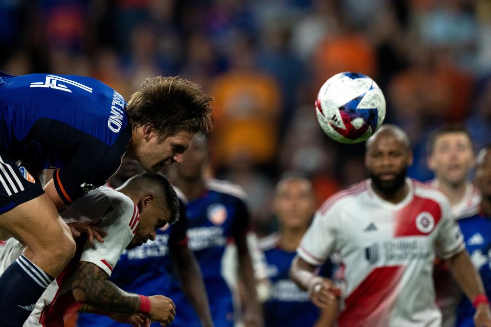 Nick Hagglund (4) and the FC Cincinnati defense delivered an impressive aerial performance in Saturday's 2-2 draw against the New England Revolution.  Cincinnati's dominance in the air helped the home side at TQL Stadium keep the ball on the offensive half and keep New England's offense as quiet as possible.  (Credit: Albert Cesare/The Enquirer)