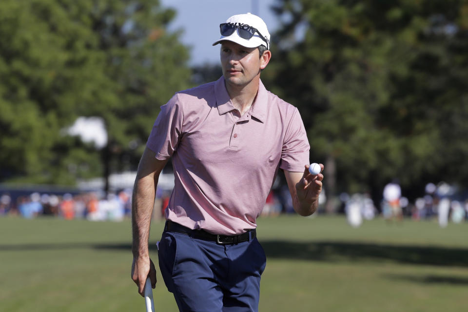 Martin Trainer acknowledges the gallery after sinking his putt on the first green during the final round of the Houston Open golf tournament Sunday, Nov. 14, 2021, in Houston. (AP Photo/Michael Wyke)