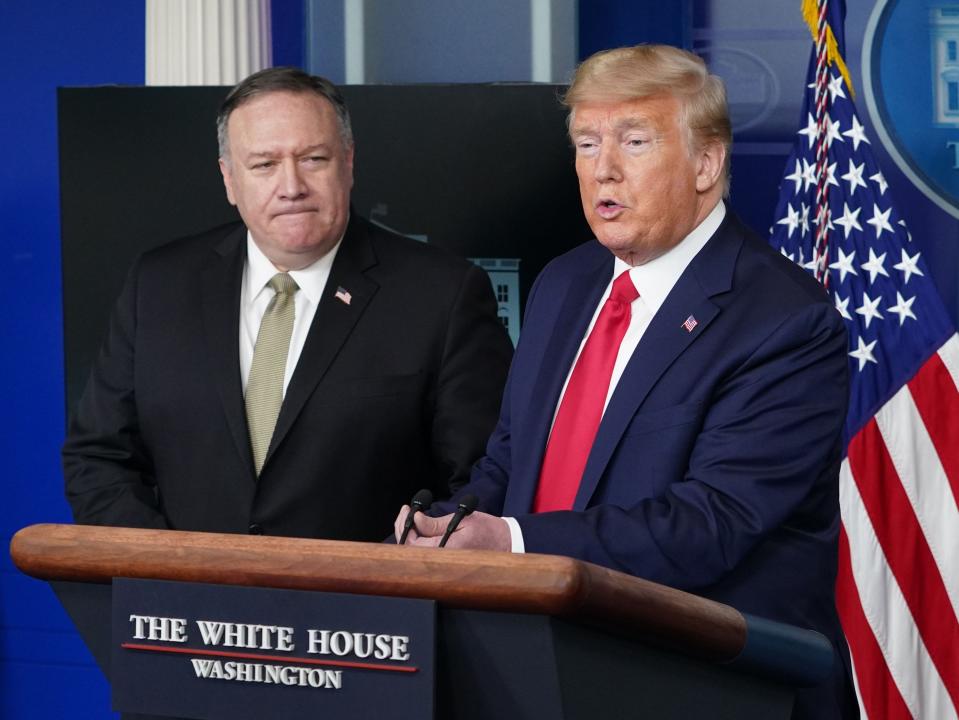 US Secretary of States Mike Pompeo watches US President Donald Trump speak during the daily briefing on the novel coronavirus, in the Brady Briefing Room at the White House on 8 April 2020, in Washington, DC ((AFP via Getty Images))