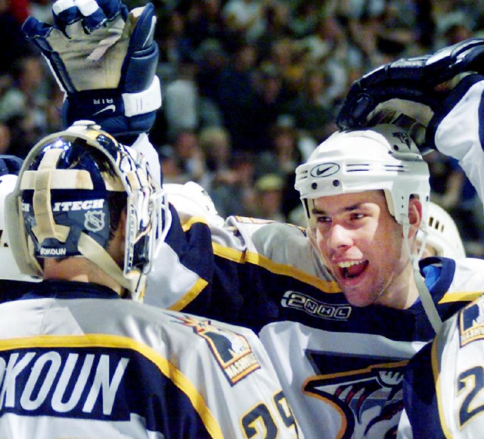 David Legwand, center, and other Nashville Predators teammates converge upon goaltender Tomas Vokoun as they celebrate their 3-2 win over San Jose on New Year's Day at GEC Jan. 1, 2000.