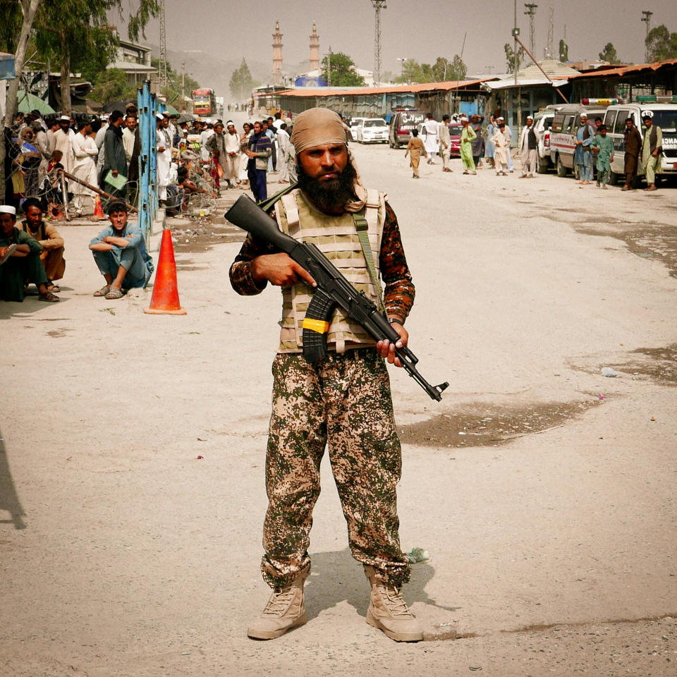 Taliban militants stand guard on the Afghanistan side of the Torkham border crossing with Pakistan. (Ian Freeborn / for NBC News)