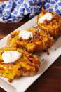 <p>Forget about the onion.</p><p>Get the recipe from <a href="https://www.delish.com/cooking/recipe-ideas/recipes/a56611/bloomin-baked-potato-recipe/" rel="nofollow noopener" target="_blank" data-ylk="slk:Delish;elm:context_link;itc:0;sec:content-canvas" class="link ">Delish</a>. </p>