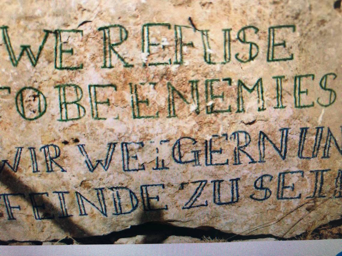 A rock with the inscription, “We refuse to be enemies,” at the Nassar family farm in the West Bank.