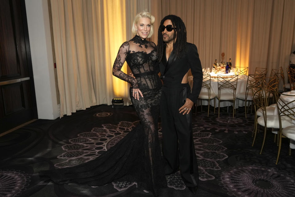 Hannah Waddingham, left, and Lenny Kravitz arrive at the 81st Golden Globe Awards on Sunday, Jan. 7, 2024, at the Beverly Hilton in Beverly Hills, Calif. (AP Photo/Chris Pizzello)