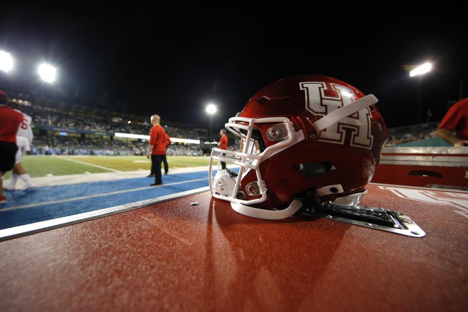 A Houston football helmet sits on the sideline in the first half of an NCAA college football game against Tulane in New Orleans, Thursday, Sept. 19, 2019. (AP Photo/Gerald Herbert)