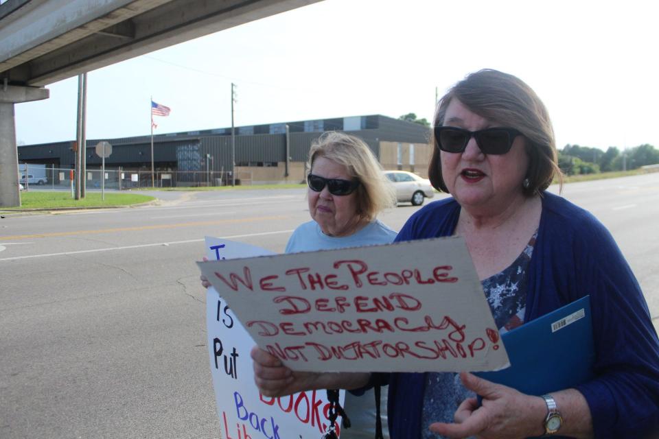 A "Bring Back Our Books Rally" formed outside of Pensacola's J.E. Hall Center Tuesday prior to the Escambia County School Board meeting in support of returning challenged school library books to the shelves.