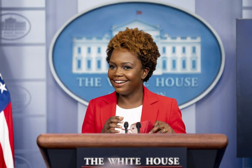 White House deputy press secretary Karine Jean-Pierre smiles as she arrives for a press briefing at the White House in Washington, Thursday, Nov. 4, 2021. (AP Photo/Andrew Harnik)