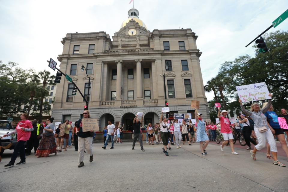 Abortion-rights supporters march from Savannah City Hall to Johnson Square.