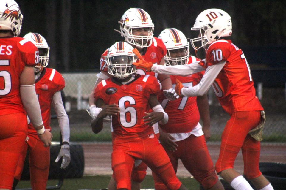 Christ's Church running back Kaleb Taylor-Burch (6) celebrates a touchdown against Beachside with teammates during a high school football game on September 12, 2022. [Clayton Freeman/Florida Times-Union]