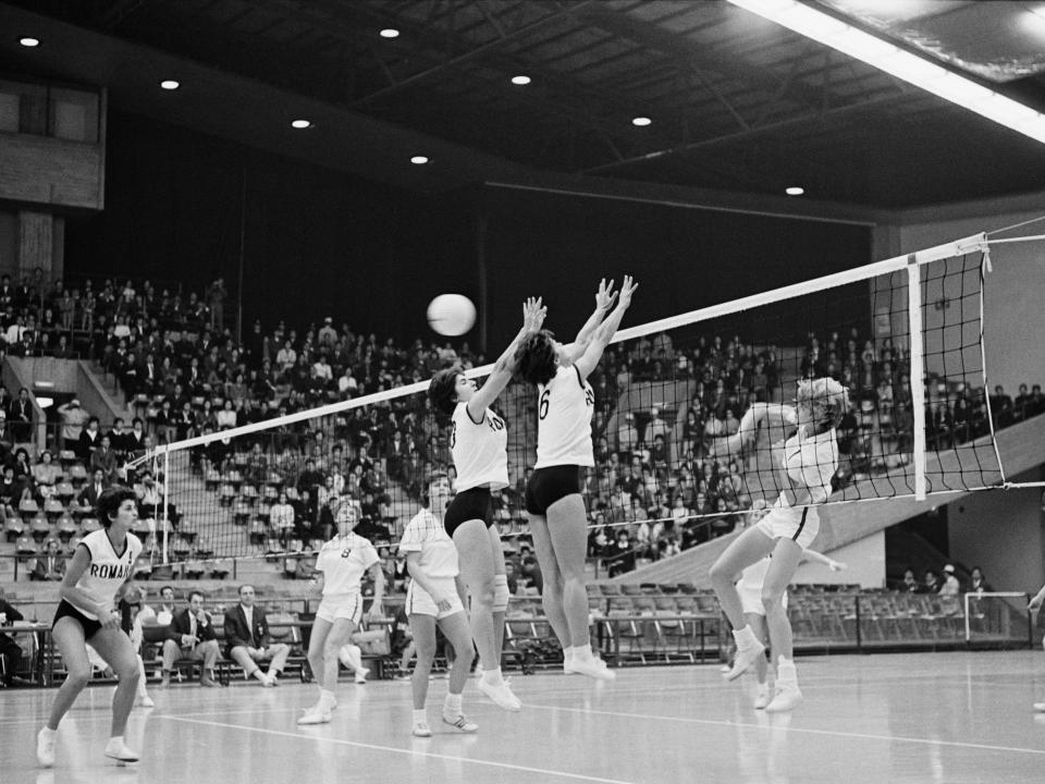A wide shot of a volleyball game during the 1964 Olympics.