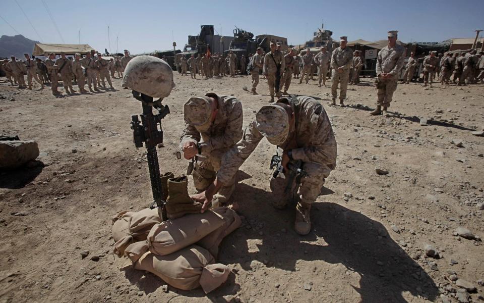 US Marine Corps soldiers pay their respects to Lance Cpl. Joshua Bernard during a memorial service in Now Zad in the Helmand Province - Julie Jacobson/AP