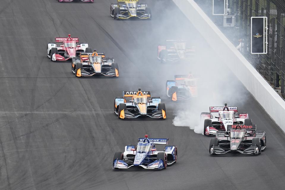 Alex Palou, (10) of Spain, leads the field for a restart during the IndyCar Grand Prix auto race at Indianapolis Motor Speedway, Saturday, May 13, 2023, in Indianapolis. (AP Photo/Darron Cummings)