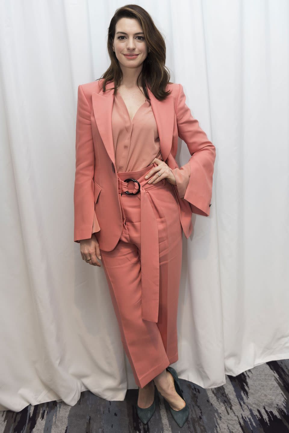 <p><strong>January 2019 </strong>Anne Hathaway chose a soft salmon two-piece by Peter Petrov to promote her new film, Serenity.</p>