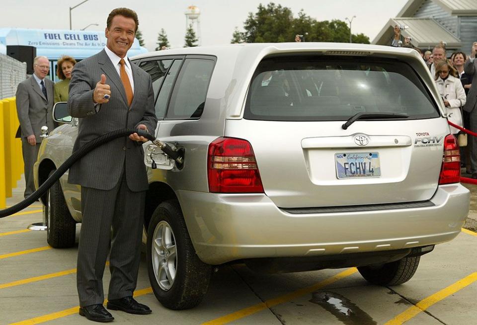  Then California governor Arnold Schwarzenegger gives the thumbs-up as he uses a hydrogen fuel pump to fill a Toyota fuel cell vehicle in Davis, California in 2004.