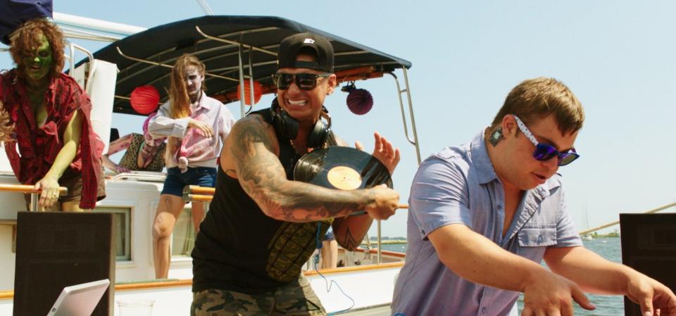 Paul "DJ Pauly D" DelVecchio, center, with Mattie Zufelt, right, during filming of the boat party scene in "Spring Break Zombie Massacre."