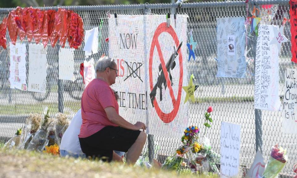 Students and residents sign a memorial in honor of the Stoneman Douglas high school shooting victims.