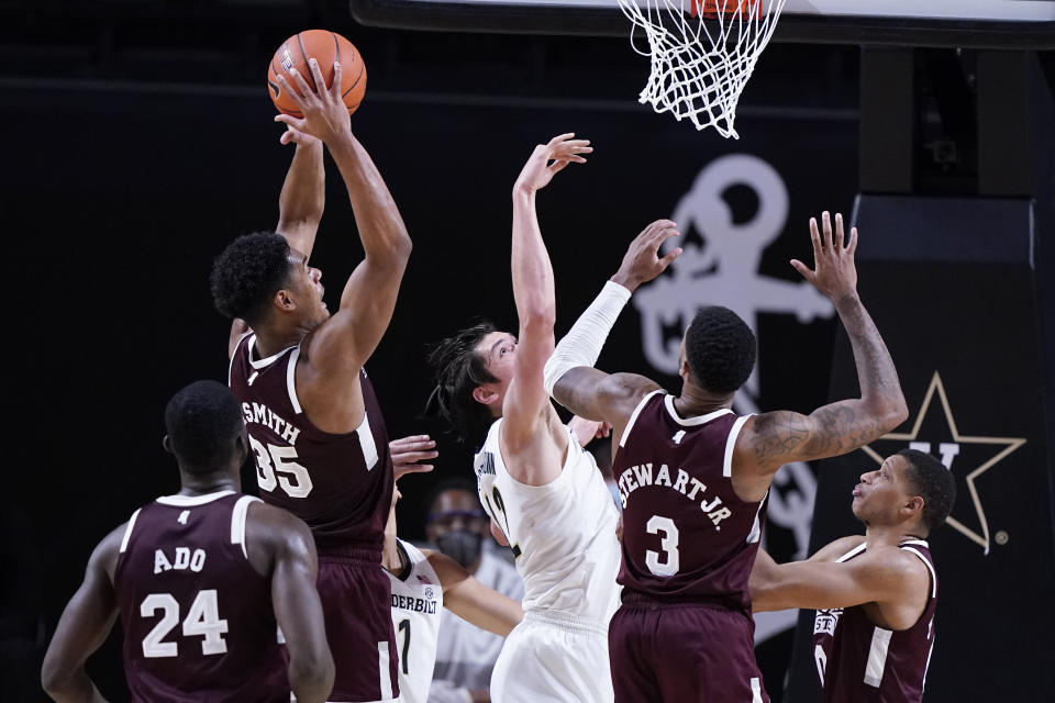 Mississippi State forward Tolu Smith (35) grabs a rebound away from Vanderbilt forward Quentin Millora-Brown (42) in the second half of an NCAA college basketball game Saturday, Jan. 9, 2021, in Nashville, Tenn. (AP Photo/Mark Humphrey)