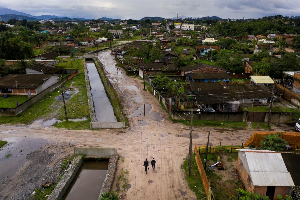 Elders Tanner McKee and Pedro Cabral, missionaries for The Church of Jesus Christ of Latter-day Saints, walk through the Labra neighborhood of Paranaguá, Brazil, on Sunday, June 2, 2019. | Spenser Heaps, Deseret News