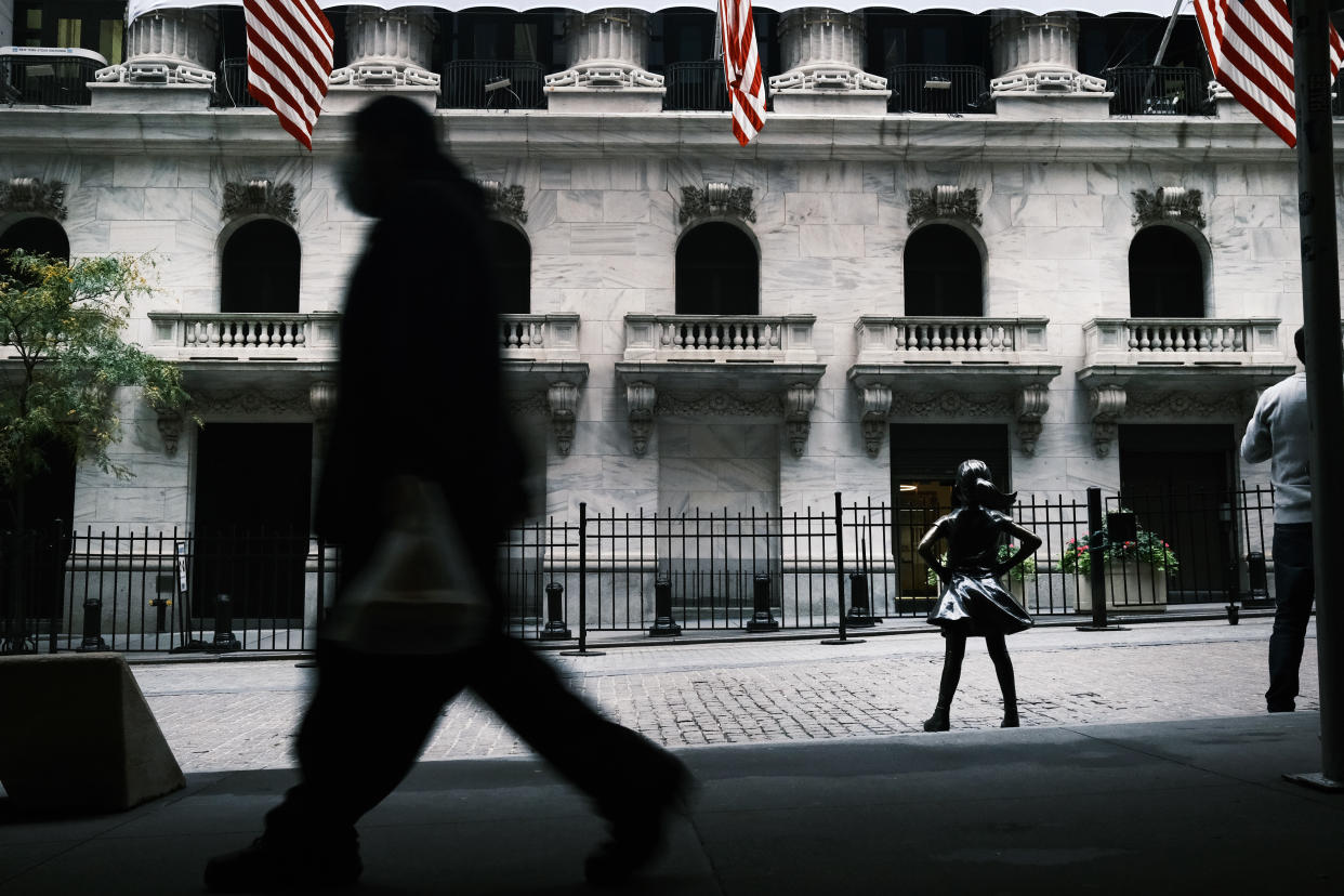 NEW YORK, NEW YORK - OCTOBER 28: People walk by the New York Stock Exchange (NYSE) in Manhattan's financial district on October 28, 2020 in New York City. The Dow Jones Industrial Average fell sharply on Wednesday as fears grow over the worsening situation with the coronavirus pandemic's new wave across Europe and parts of America. Stocks on Wall Street fell over 900 points at the close of the trading day. (Photo by Spencer Platt/Getty Images)