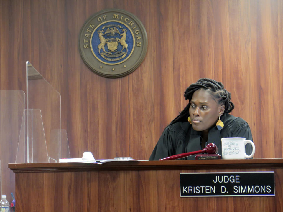 Ingham County District Court Judge Kristen Simmons oversees a preliminary examination in Lansing, Mich., on Wednesday, Dec. 13, 2023, for six of the 15 Michigan Republicans who face forgery and other charges for serving as false electors for then-President Donald Trump in 2020. Simmons will rule at the conclusion of the hearing whether the prosecution has met their burden of proof for the cases to be bound over to the circuit court. (AP Photo/Joey Cappelletti)