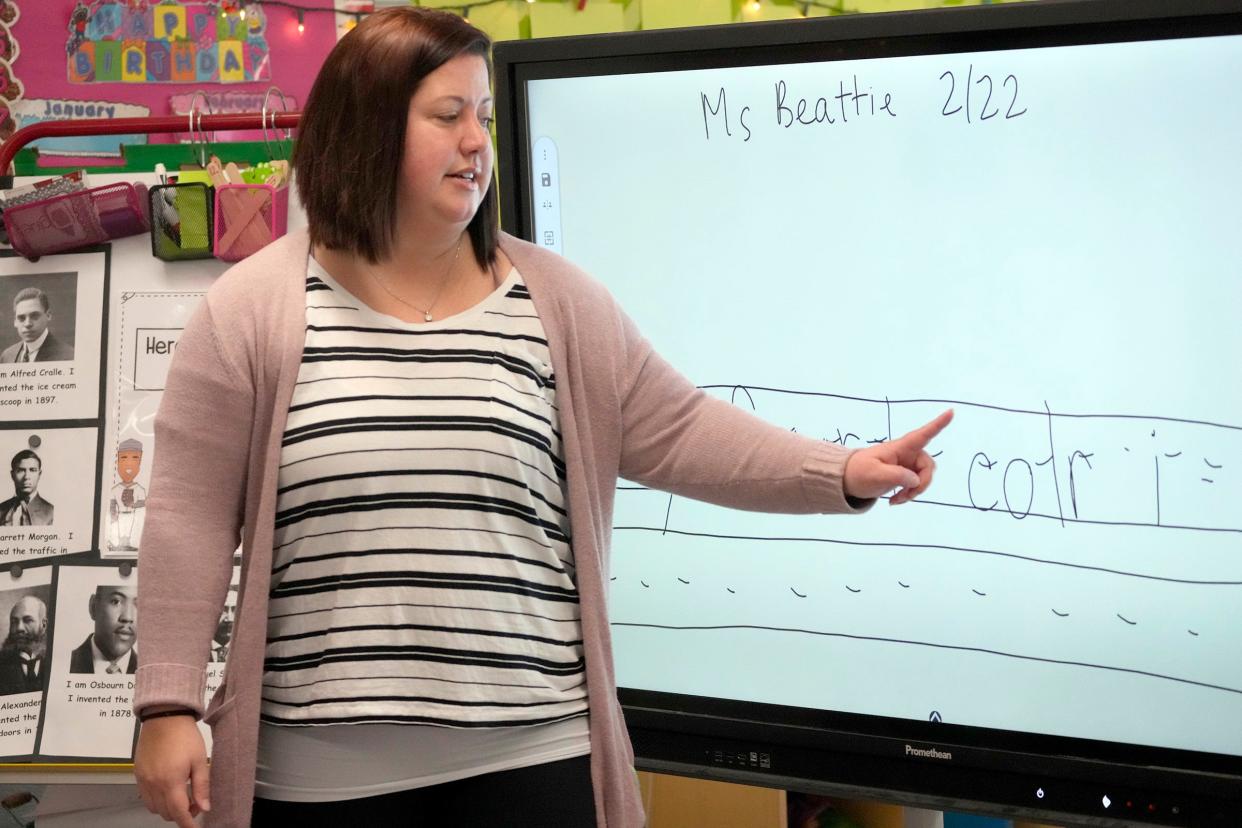 Hawthorne School K-5 teacher Katie Beattie works with students on a reading and spelling lesson at the school on North 41st Street in Milwaukee.