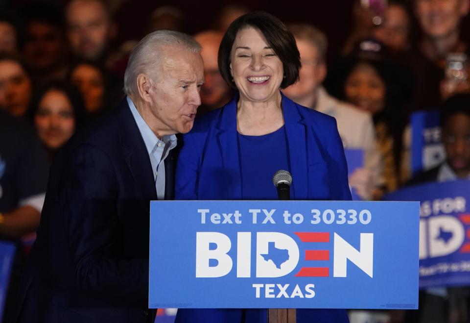 Democratic presidential candidate and former Vice President Joe Biden speaks into the microphone as his former rival for the 2020 Democratic presidential nomination, Senator Amy Klobuchar, endorses him during a campaign event in Dallas, Texas, U.S., March 2, 2020. Eric Thayer/Reuters