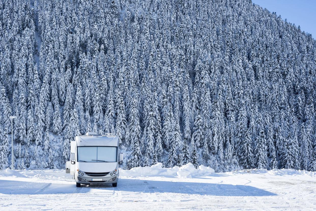 Motor home parked in a winter scene
