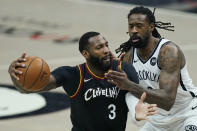 Cleveland Cavaliers' Andre Drummond (3) drives past Brooklyn Nets' DeAndre Jordan (6) during the first half of an NBA basketball game, Wednesday, Jan. 20, 2021, in Cleveland. (AP Photo/Tony Dejak)