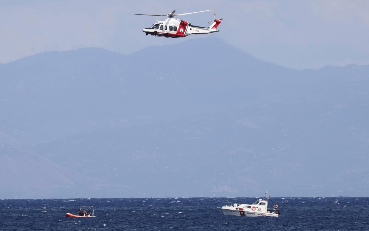 Rescue teams search the water