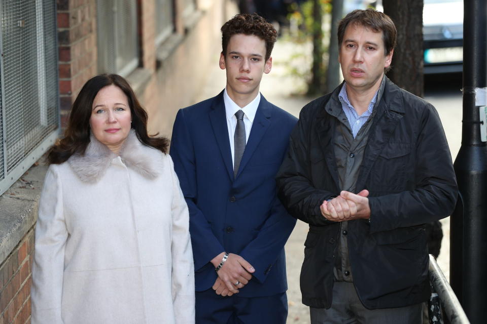 Tanya and Nadim Ednan-Laperouse, with their son Alex, outside West London Coroners Court (PA)