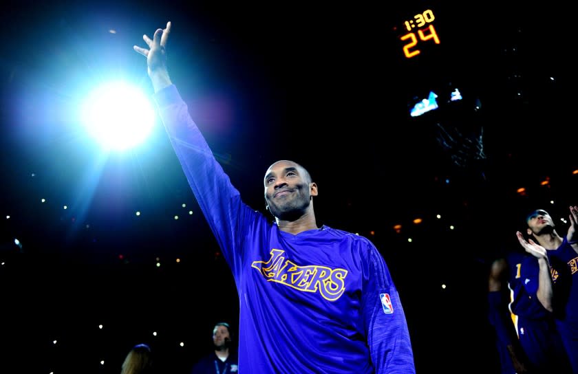 Kobe Bryant waves to the crowd as he is introduced before a game against the Thunder in Oklahoma City on April 11.