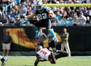 <p>Christian McCaffrey #22 of the Carolina Panthers runs the ball against Carlton Davis #33 of the Tampa Bay Buccaneers in the first quarter during their game at Bank of America Stadium on November 4, 2018 in Charlotte, North Carolina. (Photo by Streeter Lecka/Getty Images) </p>