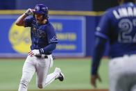 Tampa Bay Rays' Brett Phillips, left, circles the bases after hitting a three-run home run against the Detroit Tigers during the 10th inning of a baseball game Friday, Sept. 17, 2021, in St. Petersburg, Fla. (AP Photo/Scott Audette)