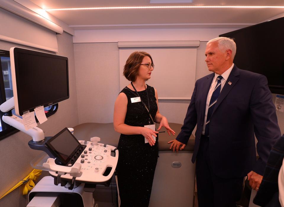 Carla Beasley, left, nurse manager with the Carolina Pregnancy Center, speaks to former Vice President Mike Pence, as he tours the mobile unit, during the CPC's annual fundraising Spring Gala, at the Spartanburg Memorial Auditorium in Spartanburg, SC, Thursday, May 5, 2022.