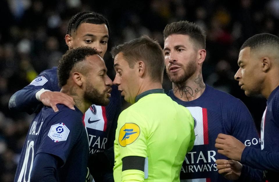 Neymar confronts referee Clement Turpin after being shown red (AP)