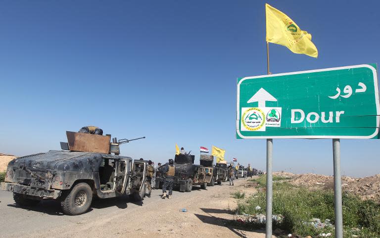 Members of the Iraqi security forces from Samarra, north of Baghdad, head towards al-Dawr area south of Tikrit, to launch an assault against the Islamic State group (IS), on February 28, 2015