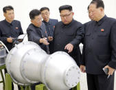 FILE - This undated file photo distributed on Sept. 3, 2017, by the North Korean government, shows North Korean leader Kim Jong Un, second from right, at an undisclosed location. U.S President Donald Trump announced Tuesday, Feb. 5, 2019 during his State of the Union address that he intends to meet Kim on Feb. 27-28, 2019 in Vietnam, saying that although much work remains to be done toward peace on the Korean Peninsula, his relationship with Kim is a good one. Independent journalists were not given access to cover the event depicted in this image distributed by the North Korean government. The content of this image is as provided and cannot be independently verified. (Korean Central News Agency/Korea News Service via AP, File)