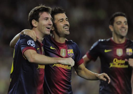 Goleador argentino del FC Barcelona celebra conquista junto a su compañero de ataque David Villa (D) tras convertir durante el partido por la UEFA Champions League ante el FC Spartak Moscou en el Camp Nou el 19 de setiembre de 2012. (AFP | josep lago)