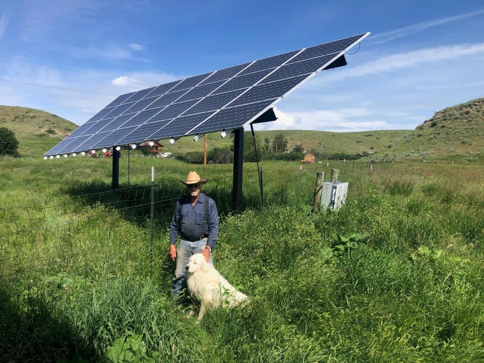 Central Montana rancher Giles Stockton stands before the solar array he recently had installed at his ranch outside of Grass Range.