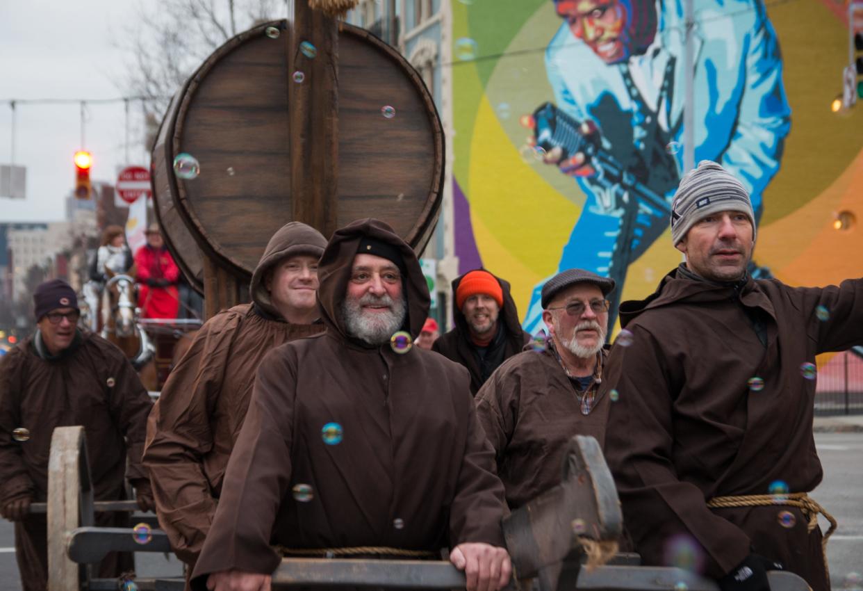 Faux monks pull a Trojan goat along the Bockfest parade route.