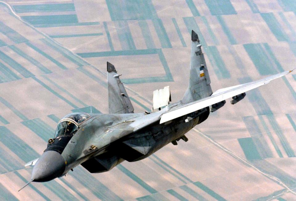 A Yugoslav airforce Mig-29 fighter flies over Belgrade in June 1998 (AP)