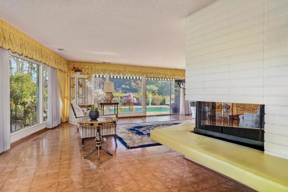 Nancy Sinatra - Former Home - Beverly Hills - Living Room - Fireplace - Yellow Built-in Seating